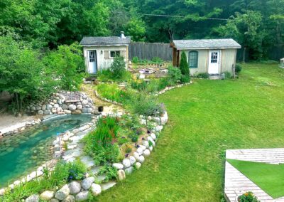 Two small houses with greenery